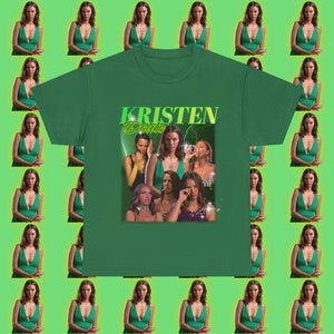 May include: Green t-shirt with a graphic print of a woman's face and the text "KRISTEN Doute".