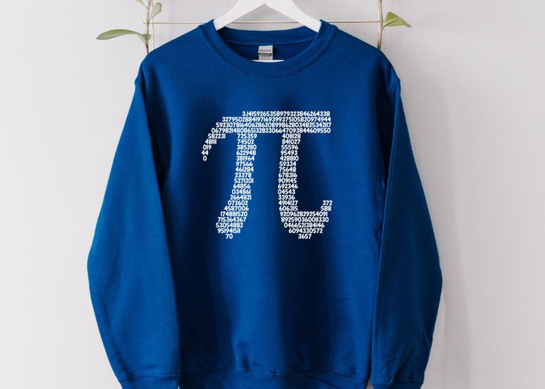 May include: A royal blue sweatshirt featuring a white graphic of the mathematical constant pi, formed by the digits of pi.