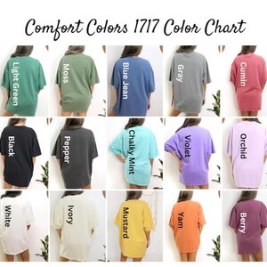 May include: A Comfort Colors 1717 color chart featuring fifteen short-sleeve t-shirts in various solid colors including light green, moss, blue jean, gray, cumin, black, pepper, chalky mint, violet, orchid, white, ivory, mustard, yam, and berry.