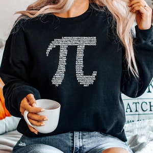 May include: Black sweatshirt with a white graphic of the mathematical constant pi, showing the first 100 digits of the number.