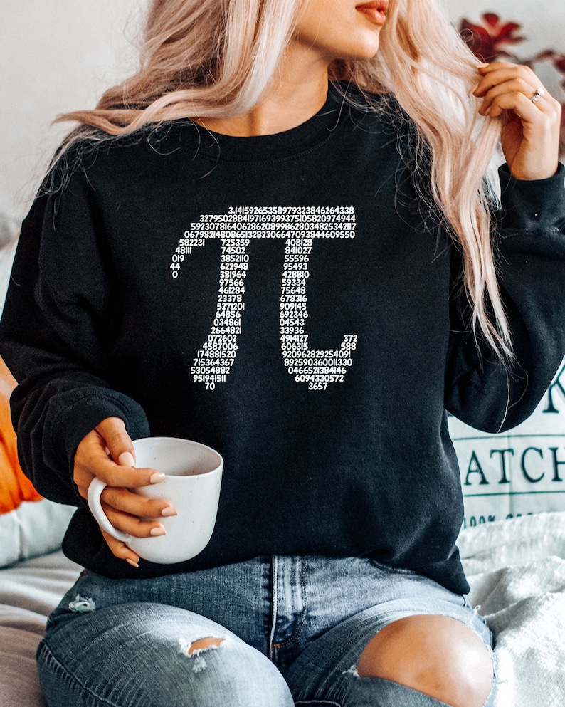 May include: Black sweatshirt with a white graphic of the mathematical constant pi, showing the first 100 digits of the number.