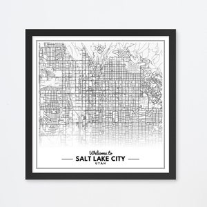 May include: Black and white map print of Salt Lake City, Utah in a black frame. The map is surrounded by a white border with the text "Welcome to Salt Lake City, Utah" at the bottom.