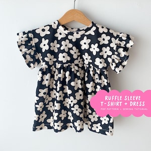 May include: A black and white floral print ruffle sleeve t-shirt and dress sewing pattern. The pattern includes a PDF pattern and sewing tutorial.  "Ruffle Sleeve T-Shirt + Dress" is written in pink on a white cloud.