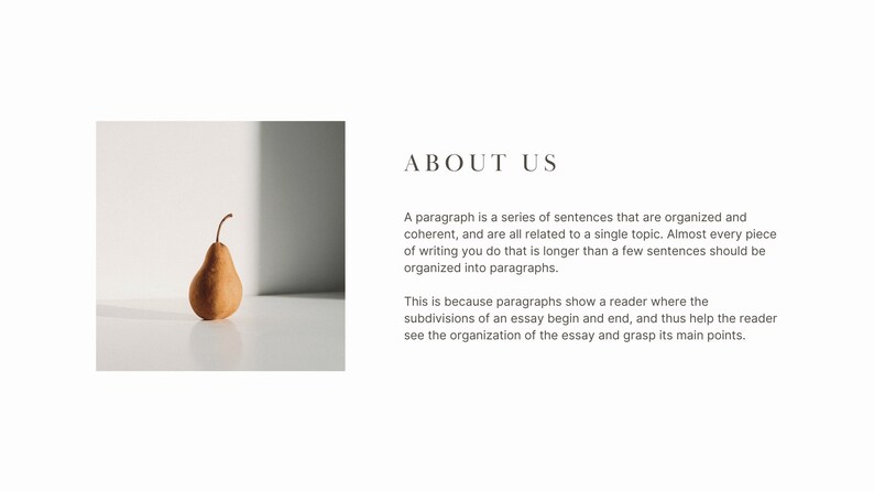 May include: A single brown pear sits on a white surface with a shadow cast on the wall behind it. The text "ABOUT US" is in the upper right corner of the image.