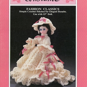 May include: A crochet doll wearing a cream-colored dress and hat with pink ribbon accents. The doll is part of a "Fashion Classics" pattern, designed for a 15-inch doll. The image includes the name "Constance" and the Fibre Craft logo.