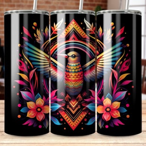 May include: A black tumbler with a colorful hummingbird design. The hummingbird is surrounded by flowers and leaves in shades of pink, purple, blue, and yellow. The background is black with a geometric pattern.