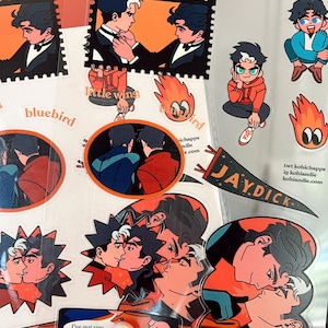 May include: A set of stickers featuring illustrations of two men in various poses. The stickers are printed on clear vinyl and have a glossy finish. The stickers include text such as "bluebird", "little wing", "Jaydick", and "I've got you".