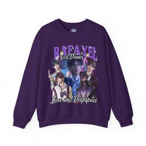 May include: Purple sweatshirt featuring a graphic print of a group of men with the text "Rafael Girl Dinner Love and Deep Space" in a retro style.