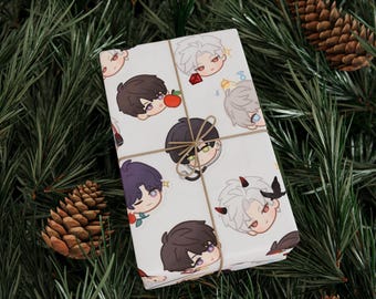 May include: A wrapped present with a white surface, decorated with cartoon character faces in multiple colours. The gift is tied with twine and placed on a bed of pine needles and pine cones, creating a festive holiday theme.