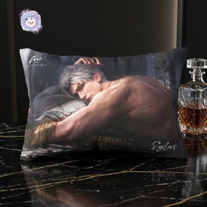 May include: A rectangular pillow with a printed image of a person with silver hair, resting on a bed. The pillow has the text "Love and Deepspace" and the name "Sylus" printed on it. A glass decanter is visible in the background.