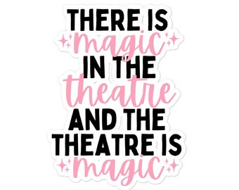 May include: White sticker with black and pink text that reads "There is *magic* in the theatre and the theatre is *magic*"
