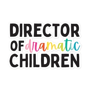 May include: A white sticker with black text that reads "Director of dramatic children". The word "dramatic" is written in colourful script.