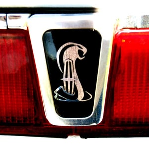 Official Lincolnmotorsport Cobrastar Chrome trunk lock cover kit. Kit fits both Lincoln Mark VII, Lincoln Mark VIII.