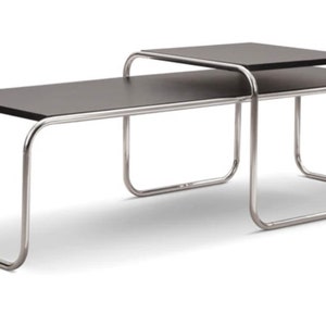 May include: Two chrome coffee tables with black tops, one nested inside the other.