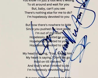 Letra de canción auténtica firmada por Olivia Newton-John con certificado