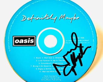 CD original firmado por Noel Gallagher + Certificado de Autenticidad (COA)