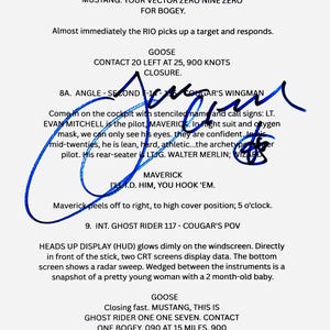 May include: A printed script page featuring black text on a white background, including dialogue and scene descriptions from a film. A prominent, bold blue ink signature is written across the center of the page, overlapping the printed text.