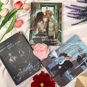 May include: Three books with the title "Breath Mints and Battle Scars" are displayed. The covers feature illustrations of couples, with one cover showing a couple kissing. The books are surrounded by flowers, including pink tulips and a red rose.