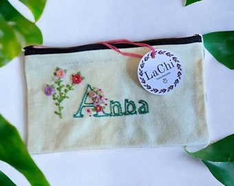 Clutch, cosmetic bag in hand-embroidered canvas personalized with floral name writing