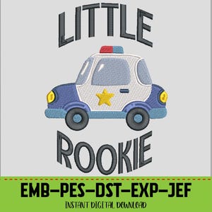 May include: An embroidered design featuring a police car with the words "LITTLE ROOKIE" above and below the car. The police car is blue, white, and gray with a yellow star on the side. The design also includes the text "EMB-PES-DST-EXP-JEF" and "INSTANT DIGITAL DOWNLOAD".