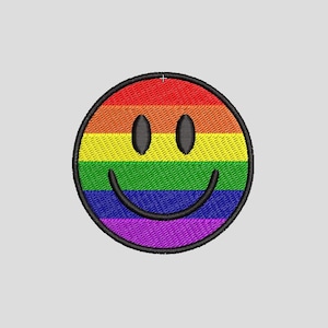 May include: Embroidered patch featuring a rainbow-colored smiley face. The design includes a black outline and a smiling mouth, with the rainbow colors arranged in horizontal stripes. The patch is circular in shape.