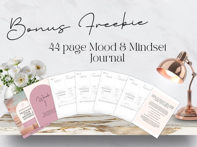May include: A freebie 44-page Mood & Mindset Journal with a pink cover and the text "Tracking Your Moods & Mindset" on the front. The journal is open to a page with a mood tracker and the text "Week 1".