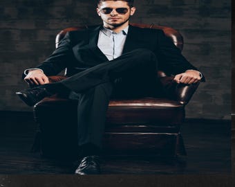 May include: A man wearing a black suit and sunglasses sits in a brown leather armchair against a dark grey textured wall. The text "WEALTHY MINDSET" is at the top of the image and the text "RICH SUCCESS CODE UNLOCKED" is at the bottom of the image.