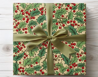 May include: A square gift wrapped in holly-patterned paper with a green ribbon and bow. The paper features a repeating design of green holly leaves and red berries on a cream background. The ribbon is a solid olive green.
