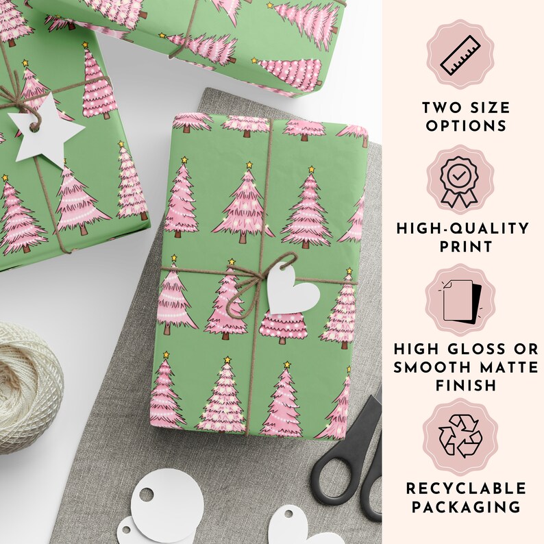 May include: Gift-wrapped presents with pink Christmas trees on green wrapping paper. The gifts are tied with twine and adorned with white star and heart-shaped tags. The image also shows text that says "TWO SIZE OPTIONS", "HIGH-QUALITY PRINT", "HIGH GLOSS OR SMOOTH MATTE FINISH", and "RECYCLABLE PACKAGING".