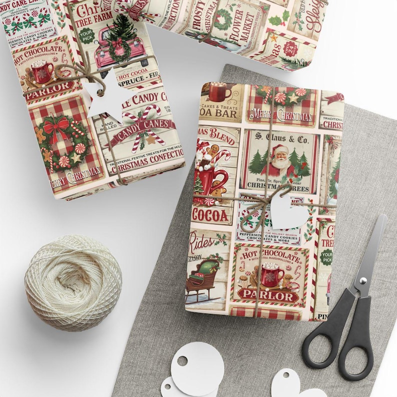 May include: Christmas-themed gift wrap with vintage-style illustrations of candy canes, hot cocoa, and Santa Claus. The gifts are tied with twine and blank tags, with scissors and a ball of twine nearby.