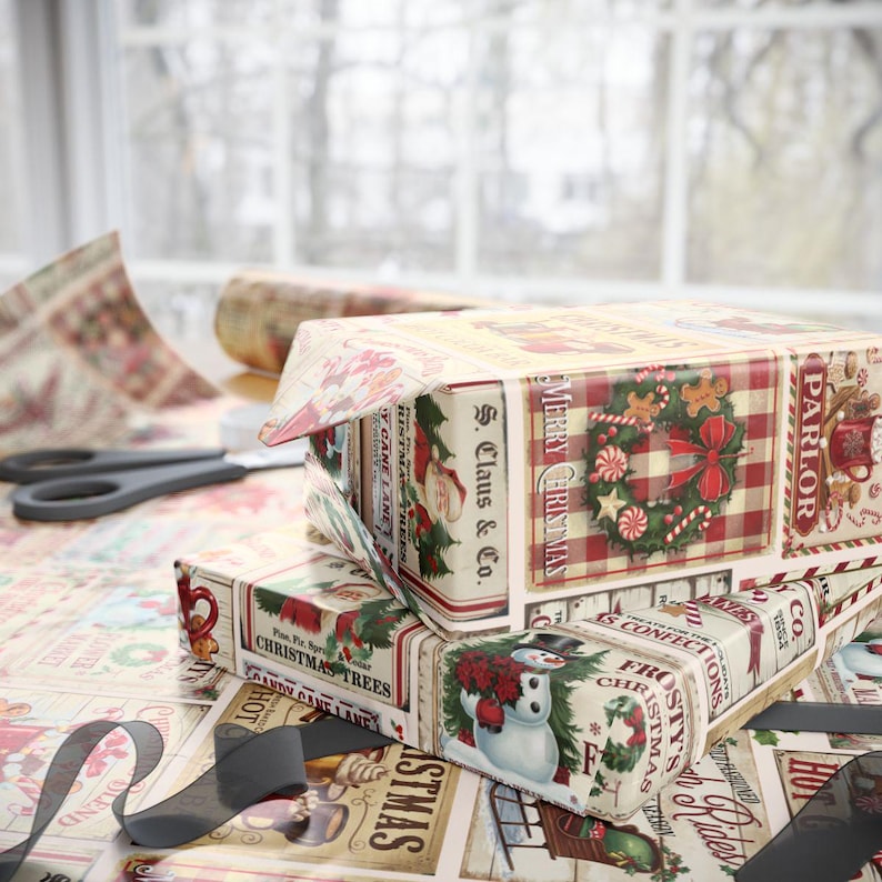 May include: Three Christmas-themed gift boxes wrapped in patterned paper with holiday imagery. The boxes feature images of Santa Claus, snowmen, and wreaths. The wrapping paper and boxes have a vintage aesthetic with text that reads "Merry Christmas" and "S. Claus & Co."