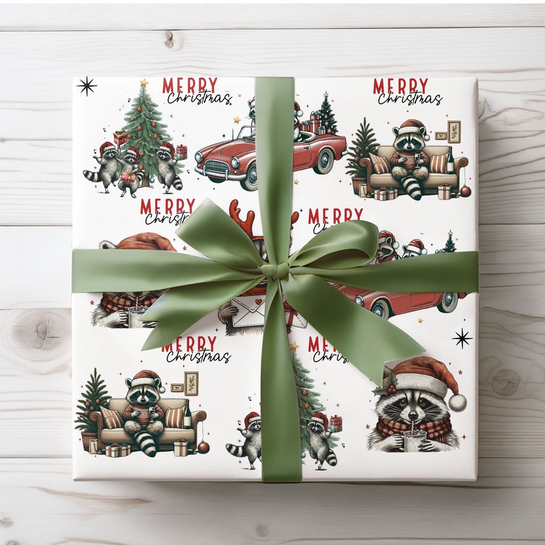 May include: White wrapping paper with a repeating pattern of raccoons in Santa hats, Christmas trees, and red convertibles. The words "Merry Christmas" are printed throughout the design. A green ribbon is tied around the wrapped gift.