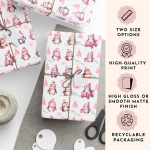 May include: White wrapping paper with a repeating pattern of penguins wearing pink hats and scarves, with pink Christmas trees. The text "Nicole" is printed on the paper. The image also shows the text "Two Size Options", "High-Quality Print", "High Gloss or Smooth Matte Finish", and "Recyclable Packaging".