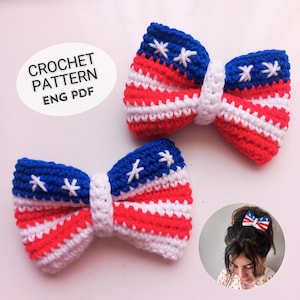 May include: Two crochet bow hair accessories in red, white, and blue, resembling the American flag. The bows have a white center and blue ends with white star accents. The text "CROCHET PATTERN ENG PDF" is in a white oval.