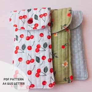 Handmade quilted glasses case with flap, beginner sewing project. Soft padded fabric eyeglass pouch with lining, quilted texture, and secure flap closure. PDF sewing pattern sample shown, protective sunglasses case, cute fabric craft gift idea.
