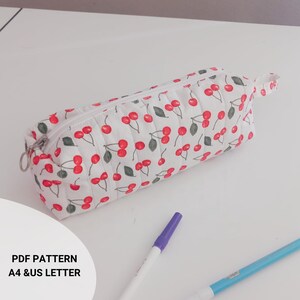 Handmade quilted pencil case, beginner sewing project. Soft padded fabric zipper pouch with lining, quilted texture. PDF sewing pattern cute fabric craft gift idea. quilted pencil case sewing pattern, zipper pouch sewing pattern, pencil case sewing tutorial, easy sewing project, beginner sewing pattern, diy fabric pouch, zippered bag pattern, quilted pouch tutorial, sewing pattern pdf, fabric scrap project, handmade gift idea, sewing for beginners, asyosh handmade