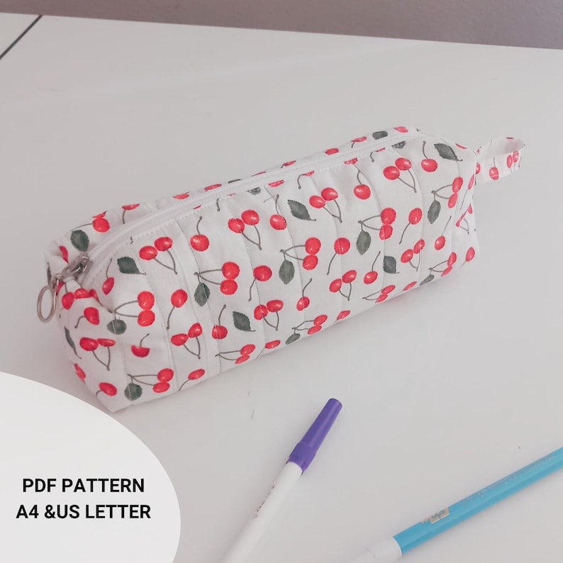 Handmade quilted pencil case, beginner sewing project. Soft padded fabric zipper pouch with lining, quilted texture. PDF sewing pattern cute fabric craft gift idea. quilted pencil case sewing pattern, zipper pouch sewing pattern, pencil case sewing tutorial, easy sewing project, beginner sewing pattern, diy fabric pouch, zippered bag pattern, quilted pouch tutorial, sewing pattern pdf, fabric scrap project, handmade gift idea, sewing for beginners, asyosh handmade