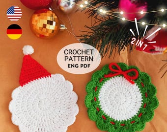 May include: A crochet pattern PDF featuring two circular coasters. One coaster is white with a red pointed hat, and the other is white with a green scalloped border and a small red bow. The text CROCHET PATTERN ENG PDF and 2 IN 1 is visible.