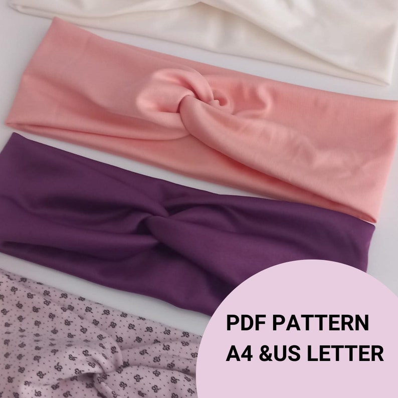 May include: Three fabric headbands in pink, purple, and white. The headbands are twisted and knotted. The image includes the text "PDF PATTERN A4 & US LETTER".