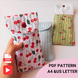 Handmade quilted glasses case with flap, beginner sewing project. Soft padded fabric eyeglass pouch with lining, quilted texture, and secure flap closure. PDF sewing pattern sample shown, protective sunglasses case, cute fabric craft gift idea.