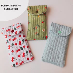 Handmade quilted glasses case with flap, beginner sewing project. Soft padded fabric eyeglass pouch with lining, quilted texture, and secure flap closure. PDF sewing pattern sample shown, protective sunglasses case, cute fabric craft gift idea.