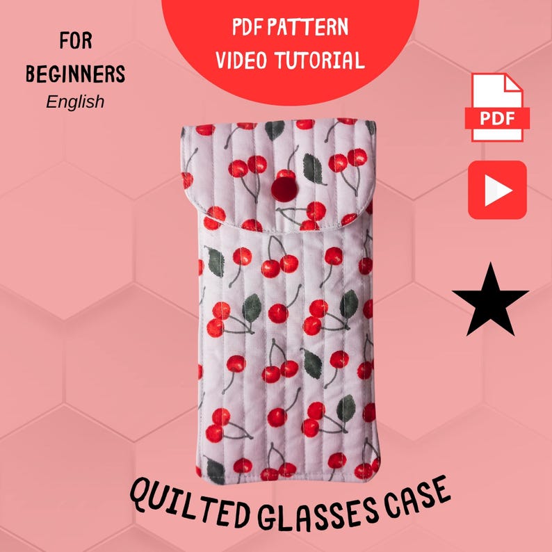 May include: Quilted glasses case with a cherry pattern on a white background. The case has a flap closure with a red button. Text on the image reads "PDF Pattern Video Tutorial" and "Quilted Glasses Case".