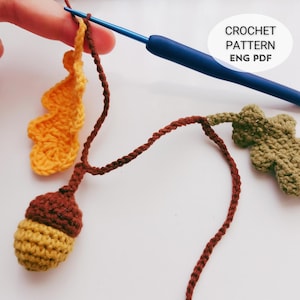 Crochet Fall Garland Pattern PDF with oak leaves and acorns, DIY crochet autumn garland for rustic home decor, handmade crochet leaf and acorn design, beginner friendly crochet tutorial with step by step photos, instant download digital crochet pattern for Thanksgiving decorations, farmhouse mantel garland, cozy crochet wall hanging, eco-friendly reusable fall decor, DIY crochet home project, unique handmade gift idea, autumn crochet table and party decoration.
