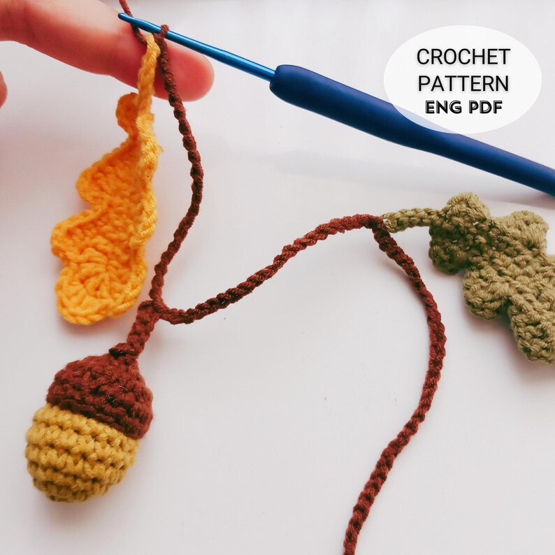 Crochet Fall Garland Pattern PDF with oak leaves and acorns, DIY crochet autumn garland for rustic home decor, handmade crochet leaf and acorn design, beginner friendly crochet tutorial with step by step photos, instant download digital crochet pattern for Thanksgiving decorations, farmhouse mantel garland, cozy crochet wall hanging, eco-friendly reusable fall decor, DIY crochet home project, unique handmade gift idea, autumn crochet table and party decoration.