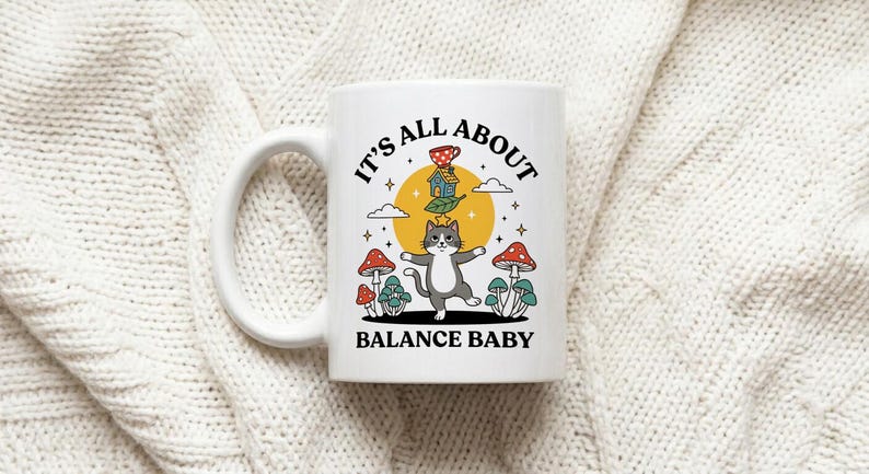 Mug Balancing Cat on Unicycle with Text It's All About Balance Baby image 1