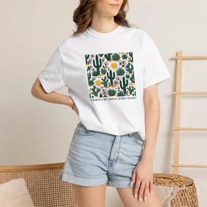 T-Shirt with Desert Plants Pattern and Quote on Strength and Delicacy image 2