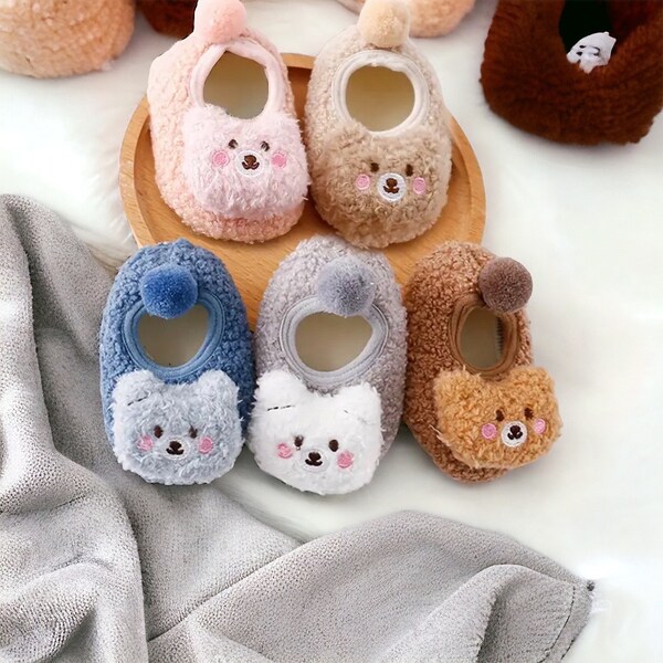 Baby slipper. Furry animal slipper. Cot shoe