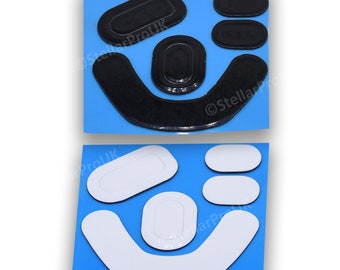 May include: A set of black and white mouse feet replacement pads. The pads are designed to fit a gaming mouse and are made of a durable material. The set includes a large pad for the bottom of the mouse, and smaller pads for the sides.