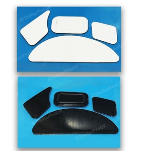 May include: A set of four mouse feet pads, two white and two black. The pads are shaped like a half-circle, a rectangle, and two smaller rectangles. The pads are designed to improve the glide of a mouse on a mouse mat.