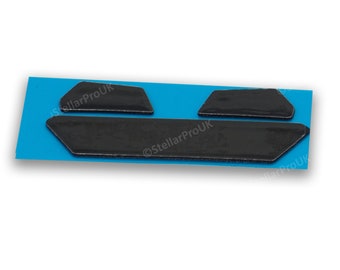 May include: A set of three black, textured adhesive pads on a blue backing. The pads are various geometric shapes, including two trapezoids and a long, rectangular piece with angled ends. The text "StellarProUK" is visible.